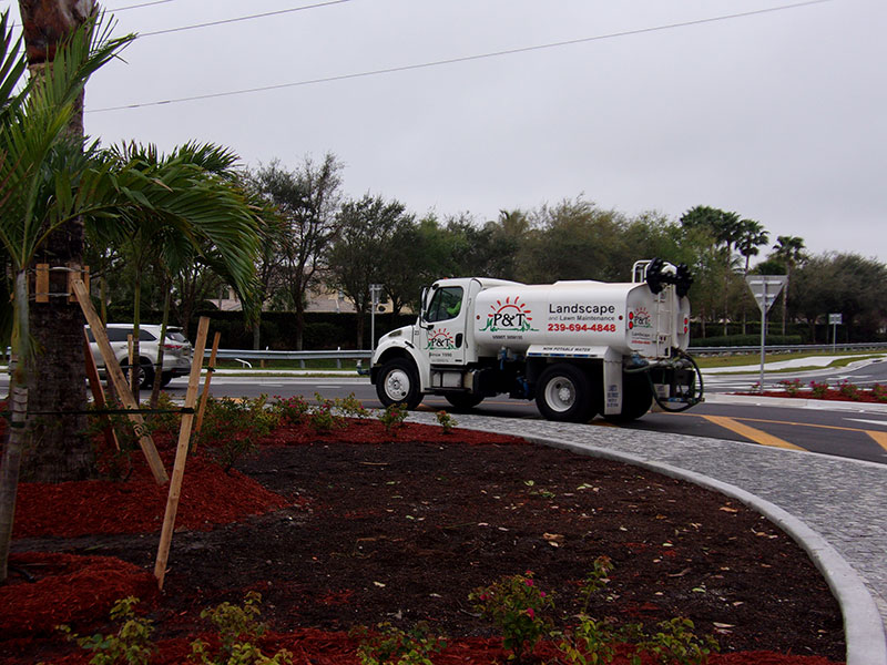 P and T Landscaping water truck driving around a round about P and T is designing and installing